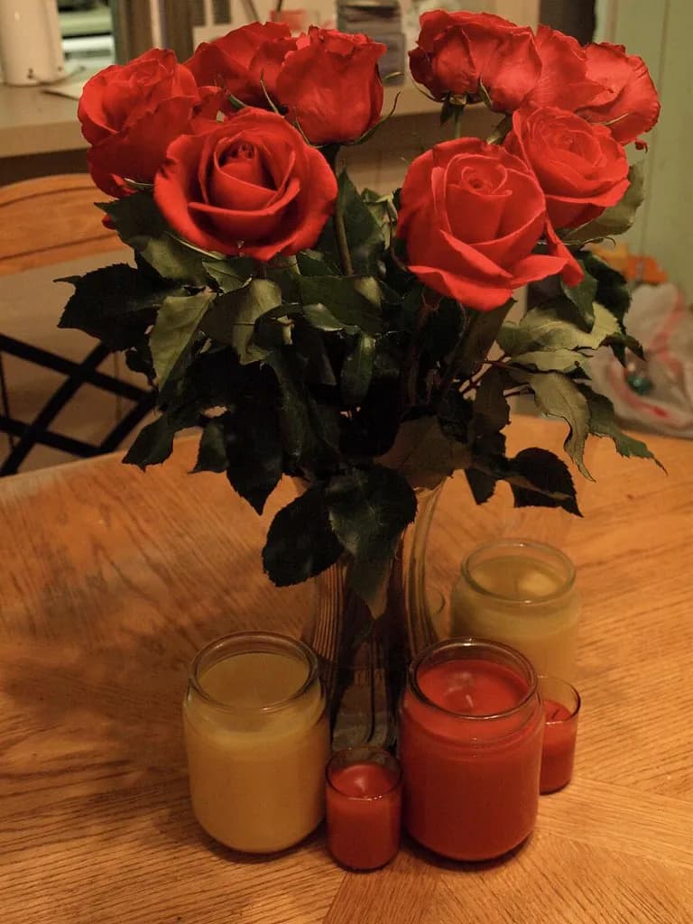 Nocturne bouquet of deep red roses with glass candles